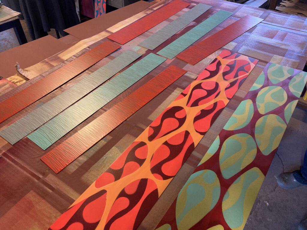 painted material on a work table, exemplifying new colors and patterns for Fall 2020