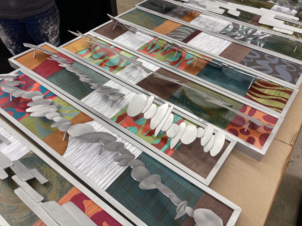a table full of artwork pending assembly