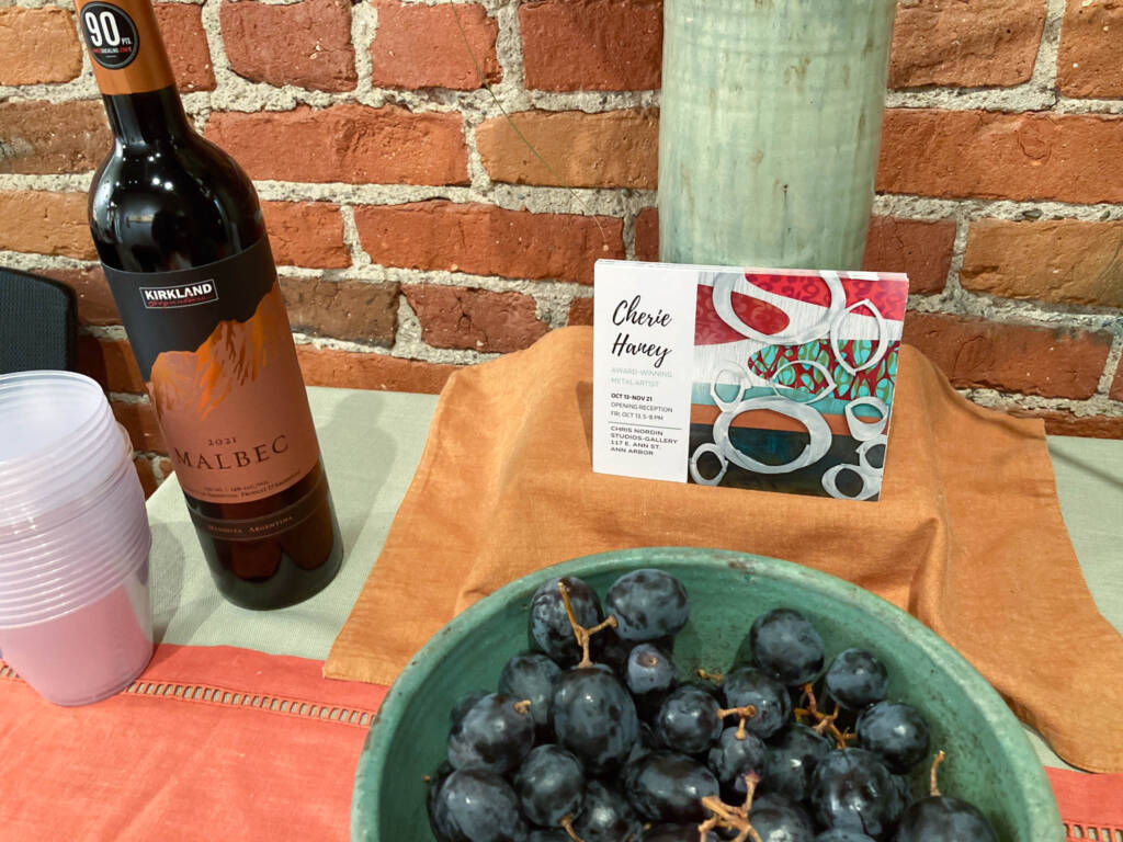 Grapes and wine on a refreshment table at Chris Nordin Studio.
