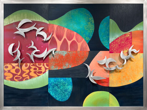 Wall art containing dimensional crescent moon shapes mounted above an assemblage of colorful enamel painted panels