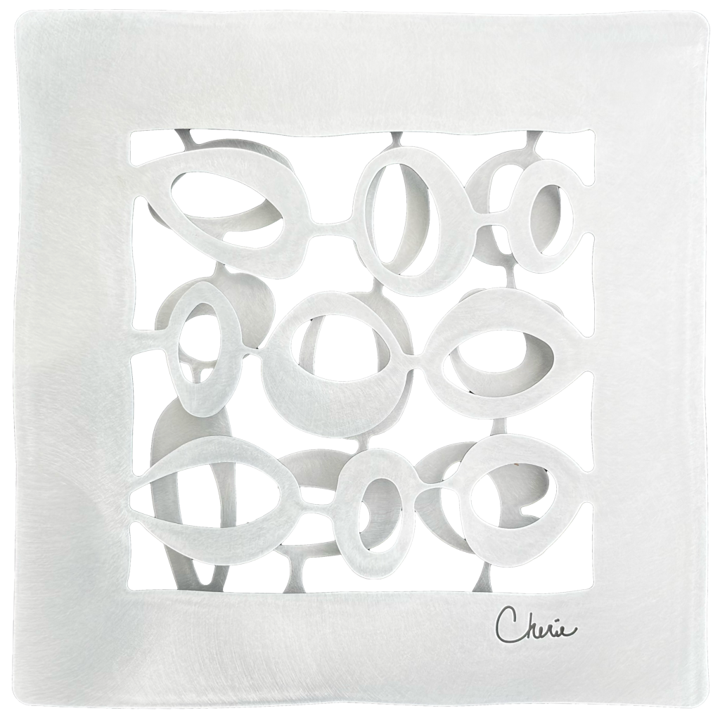 round shapes cut out of aluminum and assembled into a 3d wall tile